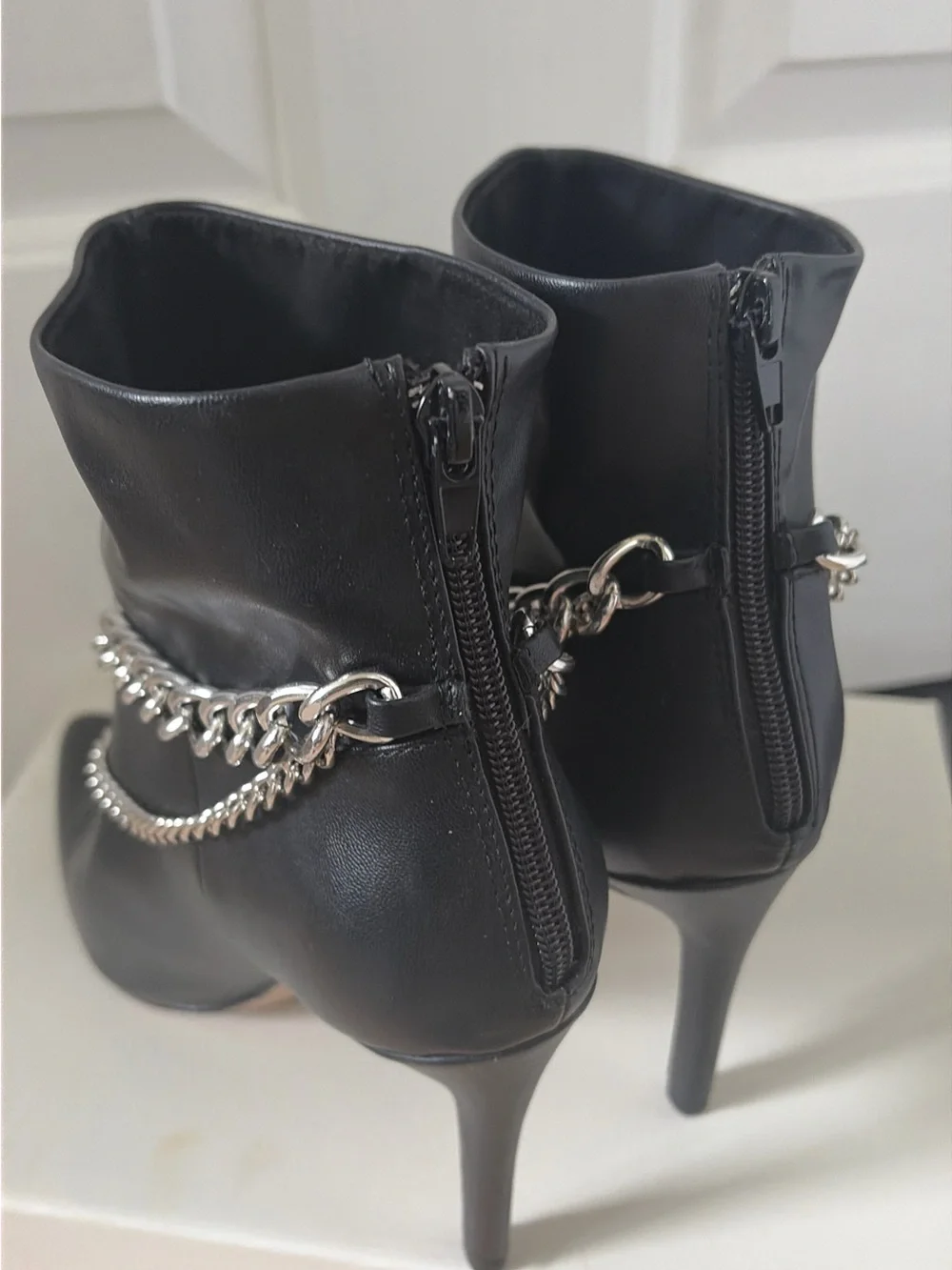 NWOT Black BCBG Chain-Accent Pointed Toe Ankle Boots in size 7.5.